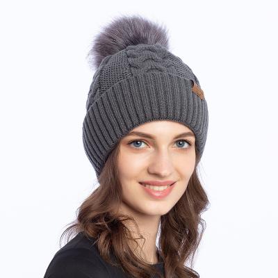 China Keeping Simple Women's Fashion Acrylic Colorful Warm Thick High Quality Wholesale Warm Winter Knitted Pom Pom Beanie Hat for sale