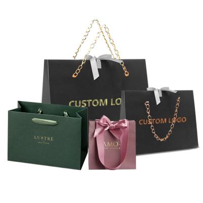 China Recyclable Custom Design Printed Ribbon Handle Luxury Boutique Kraft Paper Gift Shopping Bags Customized With Logo for sale