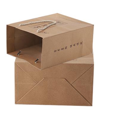 China Luxury Unique Gift Recyclable Biodegradable Portable Kraft Paper Bag Luxury Unique Gift Shopping Paper Bag With Ribbon for sale