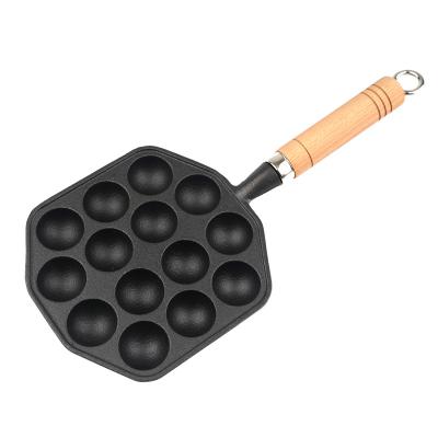 China Stocked Made in China Cast Iron Octopus Dumpling Pan with Wooden Handle Single Nonstick Dumpling Pan for sale