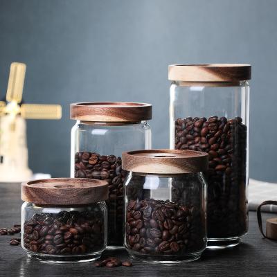 China Viable Glass Sealed Reservoir Coffee Bean Storage Tank Coarse Grain Storage Vat Teapot With Wooden Cover for sale