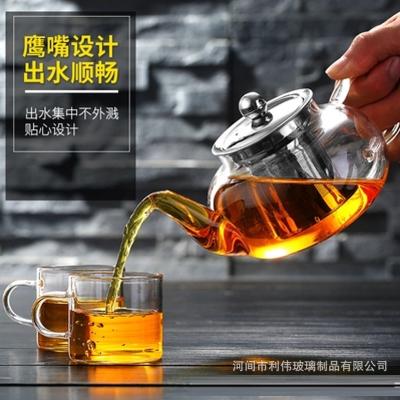 China Sustainable High Borosilicate Flower Teapot Health Pot Stainless Steel Filter Strainer Heat Resistant Glass Flower Teapot for sale