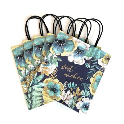 China Disposable Wholesale Custom Printed Black Luxury Shopping Paper Gift Bag With Handle for sale