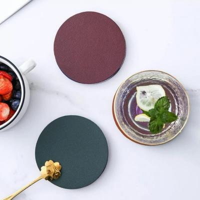 China Durable Modern Home Table Decor PU Leather Soft Waterproof Heat Resistant Round Cup Pad Round Coaster for sale