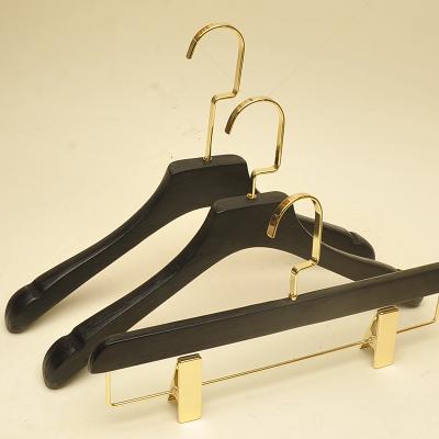 China Eco-friendly material custom engraved logo gold hook wooden coat hangers for sale for sale