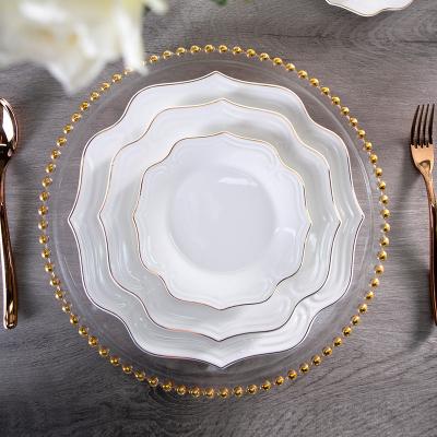 China 2022 Cheap Viable Factory Price Dinnerware Vajilla Porcelain Gold Rim Custom LOGO Dishes White Ceramic Flowers Shape Wedding Dish Set for sale