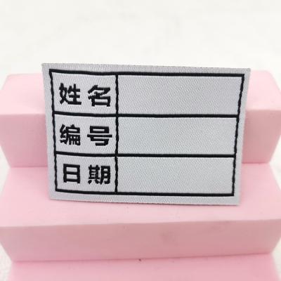 China Washable Customize Logo Label Designs Blank Woven Self Adhesive Clothing Woven Labels for sale