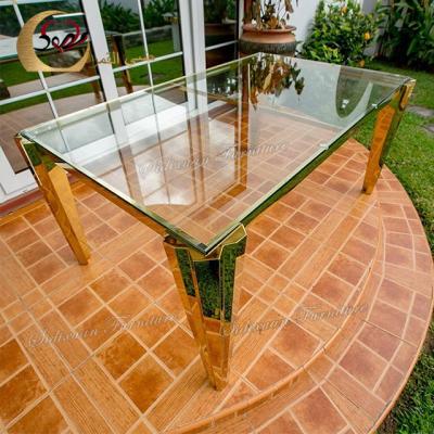 China Modern gold legs luxury banquet modern metal and glass dinning table for sale