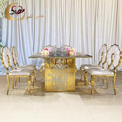 China Latest style modern furniture wedding mirror glass top golden steel table à venda