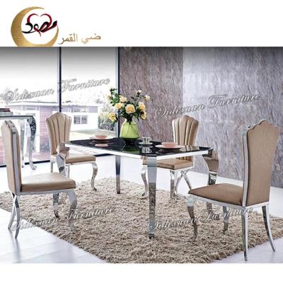 China Four legs tempered glass top rectangle luxury dining table and chair set for sale