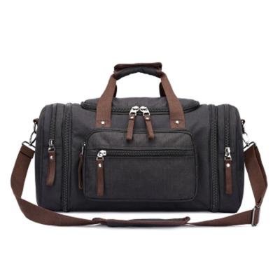 China Normcore/logo fashion minimalist wholesale custom bag camouflage large men's canvas duffel bags travel duffel bag for sale