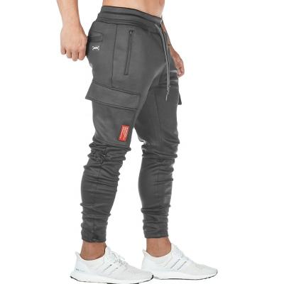 China Breathable Jogger Sportswear Gym Tracksuit Bottoms Skinny Sweatpants With Side Pockets for sale