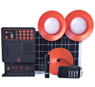 China PAYG 20W Portable Solar System Home Pay As You Come Home Light Up Solar Power System With FM Radio And Torch Light for sale