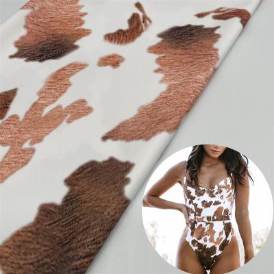 China New 90 polyester10 special stretch spandex 4 way elastic digital printing cow pattern swimsuit fabric for sale