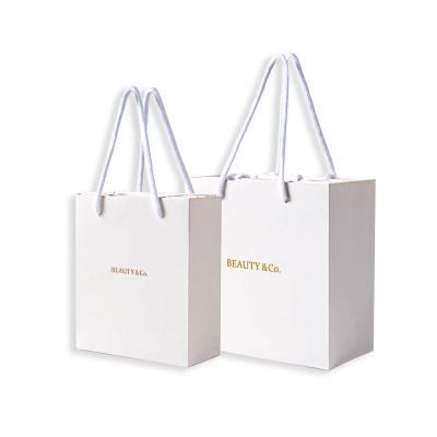 China Cardboard Custom Reusable Packaging Shopping Bag with Your Own Logo and Gravure Printing for sale