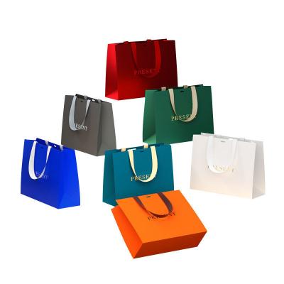 China Cardboard Hand Length Handle Luxury Matte Paper Gift Shopping Bag with Custom Logo for sale