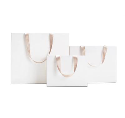 China Custom Logo Popular Boutique Shopping Paper Bag in Gravure Print Design for Shoes for sale