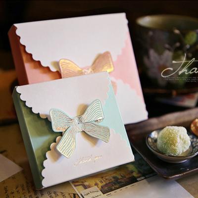 China Custom Color Recycled Folding Ivory Board Small Gift Paper Box With Bow For Kids for sale