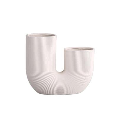 China Root Minimalist Luxury Creative U-shaped Powder Lotus Ceramic Decorative Vase for sale