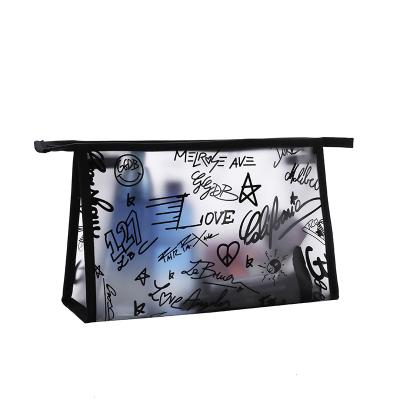 China Fashion waterproof tpu material graffiti character pattern zipper toiletry bag women travel makeup cosmetic bag for make up for sale