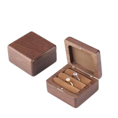 China Custom Walnut Wooden Ring Box Wood Wedding Engagement Jewelry Box Magnet for sale