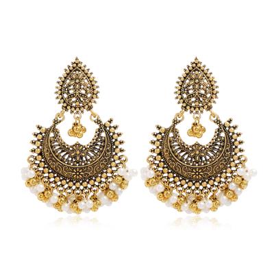 China New Design FASHIONABLE Indian Ethnic Style Retro Alloy Hollow Cut Out Pearl Beads Tassel Jhumka Earring Women for sale