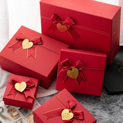 China Custom Recyclable Cheap Plain Cardboard Shoe Ribbon Luxury Gift Box Company Gift Box Packaging Boxes Apparel With Ribbon Handle for sale