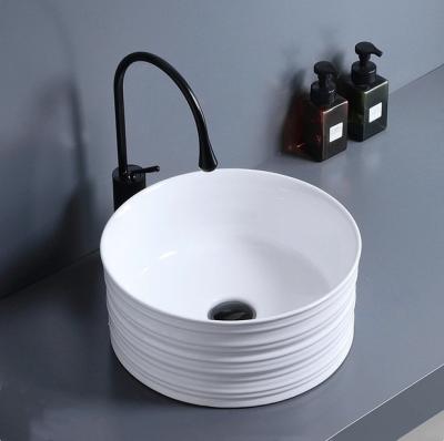 China Nordic Easy Clean Sink Round Bathroom Ceramic Art Basin Above Counter Wash Sink for sale