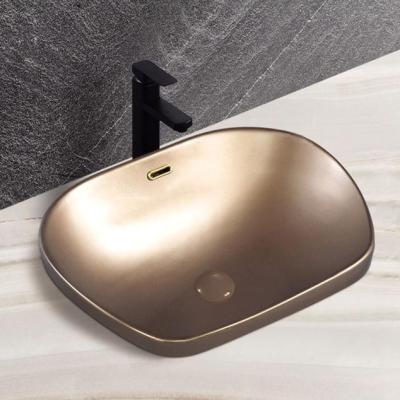 China Chaozhou easy clean factory design wholesale price unique ceramic brass washbasin above counter for sale