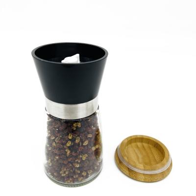 China Viable High Quality Manual Grinders Salt And Pepper Shakers Seasoning Empty Spice Glass Bottle Jars With Grinder Top for sale