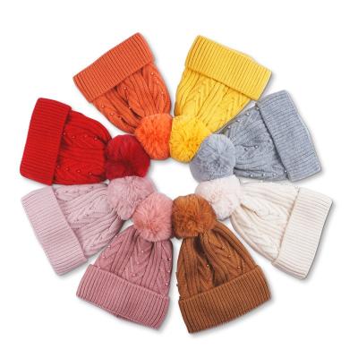 China COMMON Keep Warm Pearl Decoration Designer Women Winter Hat Thick Fleece Cable Knitted Pom Pom Beanie Cap for sale