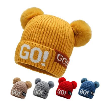 China Kids Casual Winter Warm Hats Covering Double Pom Pom Cute Crochet Knitted Yarn Jacquard Letters Baby Hat Beanies for sale