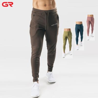 China Custom Anti-pilling Private Label Logo Printed Sweat Pants Zipper Pocket Tapered Fit Elastic Jogger Pants Men for sale