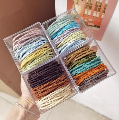 China Fashion 50 Pcs/Box Summer Girls Candy Color Hair Bands Women Elastic Rubber Hair Ties Accessory for sale