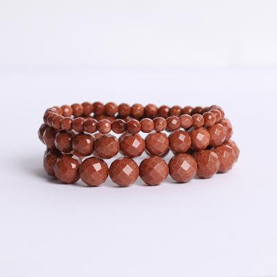 China CLASSIC Manufacturers Wholesale Natural Cut Sandstone Beads Bracelet Healing Gold Stone For Women Men for sale