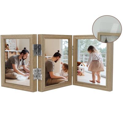 China Modern Creative Hinge Table Top Hinge Triple Folding Photo Collage Picture Frame Display Wooden Picture Frame for sale