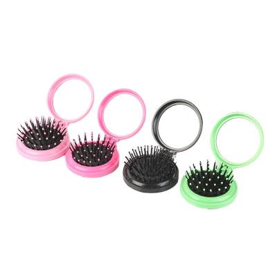 China Mini Plastic Travel Pocket Comb Professional Massage Folding Hair Brush With Mirror for sale