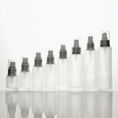 China Best Selling 20ml Cosmetic Lotion Frosting Glass Bottle With Silver Caps For Personal Care for sale