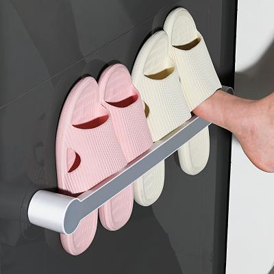 China (Other)Adjustable Bathroom Behind The Door Space Saving Portable Slippers Stretch Adhesive Towel Holder Punch Free Wall Mounted Slipper Holder for sale