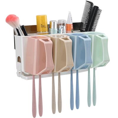 China Wall Mounted Multifunctional Viable Plastic Colorful Toothbrush Accessories Bathroom Accessories Holder With 4 Cups Family Set for sale