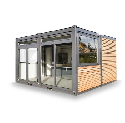 Cina 20ft Container Store Legno Grain Metal Frame Hotel Casa mobile con tubi quadrati in acciaio galvanizzato e imballaggio piatto in vendita