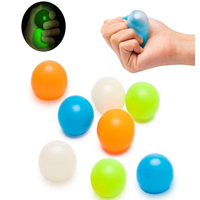 China Eco-friendly Material Hot Selling Amazon Relief Shaky Person Toys Glow In The Ceiling Wall Anti Stress Glowing Sticky Balls Dark Magic Stick Ball for sale