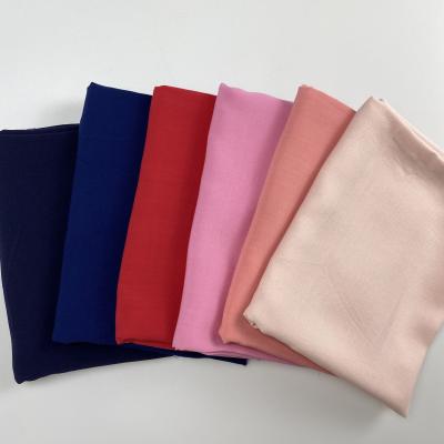 China Excellent 115 gsm organic woven solid plain dyed 100% rayon fabric to line kerchief robe for sale