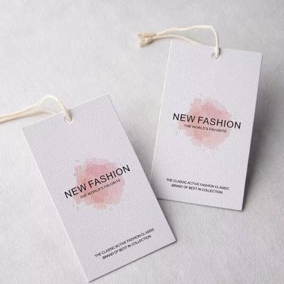 China Eco-Friendly Biodegradable Custom Logo Design Clothing Jeans Apparel Hang Tags With Strings for sale