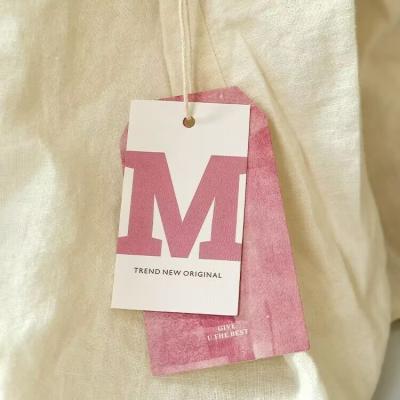 China Eco-friendly Custom Swing Hang Tags Garment Hanging Tags Logo Design Printing Clothing Paper for sale