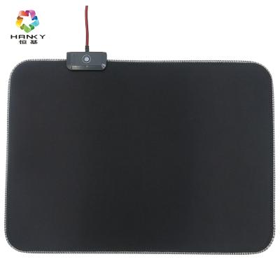 China Cloth+Rubber+Rgb Light Gaming Soft Mouse Pad Non-slip Base LED RGB Rubber Mouse Mat Desk Pad for sale