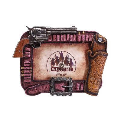 China Western Europe Cowboy Figurines The Guns Resin Picture Frame For Home Decor for sale