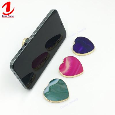 China Cheap Adjustable Regular Heart Funny Multi Function Jumping Back Sticky Grip Finger Silicone Stick Mobile Phone Cell Phone Holder for sale