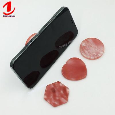 China Watermelon Tourmaline 360 ​​Adjustable Round Flexible Universal Hand Mount Mobile Cell Phone Table Popping Stand Back Sticky Holder for sale