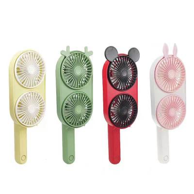 China Custom Mini Gift Mini Double Fan Shaped Hand Held Or Placed Fan Dual Function Portable Fan Hand Held Or Desktop Small Fan for sale